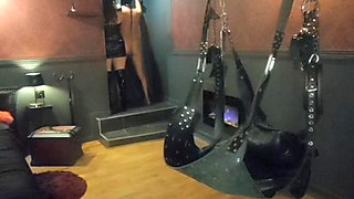 Mistress Acanthus raises her slave on a leash to the whip on the cross