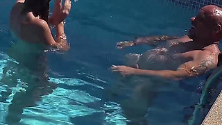 Insatiable MILF Rides Her Lover in the Pool
