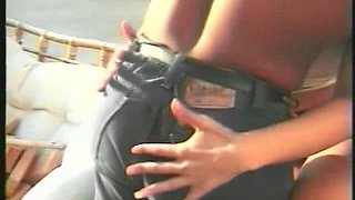 Muscular Stranger in White Superhero Mask Drills Ebony Chick on the Parking of Shopping Mall