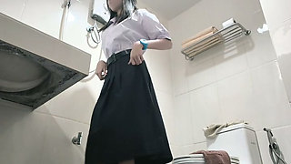 Change into a school uniform in the restroom