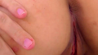 A Shaved Pussy Short-haired Nymph Shows She's Naughty.