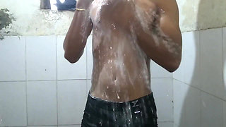 The boy masturbating inside bathroom.