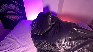Girl in Garbage Bag Plays with Her Breath