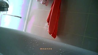 Innocent asian spy in a bathroom