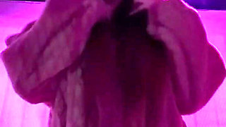 Smoking a Cigarette Outdoor While Wearing Only a Bikini and a Jacket