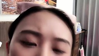 Horny Japanese teen in school uniform sucks cock