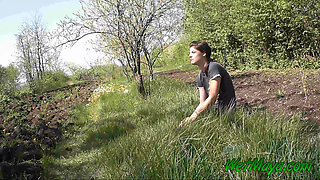 Pissing in grass on the side of the road