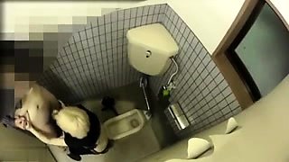 Wild Oriental girl enjoys doggystyle sex in a public toilet