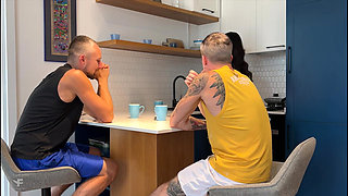 While the wife is cleaning the kitchen, her husband is giving his best friend a discreetly juicy blowjob.