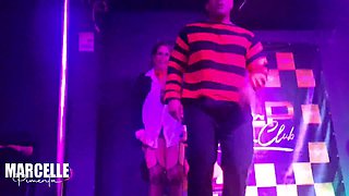 Group of girls having sex with stripper on nightclub stage