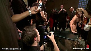 Busty slave fucked in crowded place
