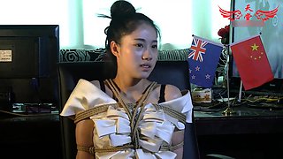Cute Chinese girl with sexy legs learns a lesson in bondage