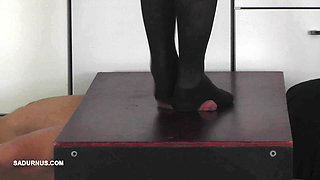 The Slave's Orgasm Under Mistress Cleo's Stocking Feet