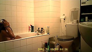 Brunette uses the toilet and takes a shower