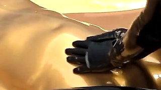 Latex Lovers Encased in Gold