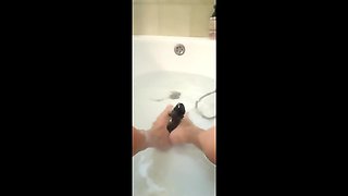 MILF Plays in the Tub with a Big Dildo