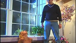 Naked blonde masturbates in hot pool while man with pantyhose on his head watches