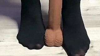 Sexy Dominatrix in Nylon Pantyhose Is Trampling Your Cock