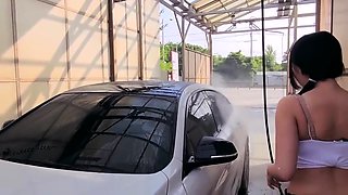 Sexy Korean woman washing her car - Asian