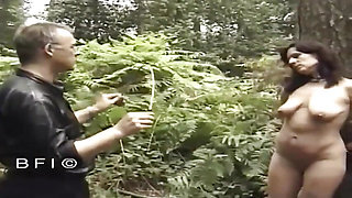 Tied up milf gets punished outdoors