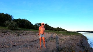 Russian Nudist on the River Shore