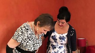 Mature lesbians toying in bed