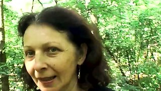 Hairy pussy granny fucks in the woods