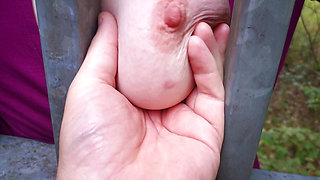 Hanging tits get slapped hard outdoors