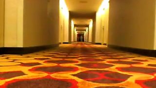 Camgirls streak hotel hallway.