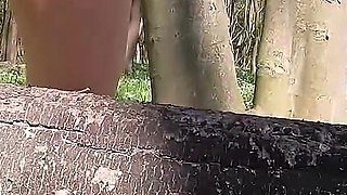 Beautiful Woman Undressing and Walking Nude with a Clit Pump Outdoors in a Public Forest