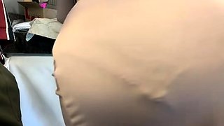 Brunette seductress working her big boobs and hot ass